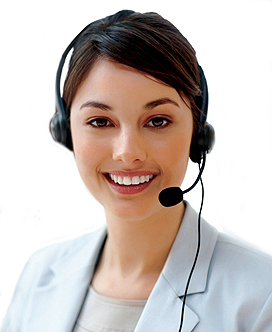 Closeup of a call center employee with headset at workplace